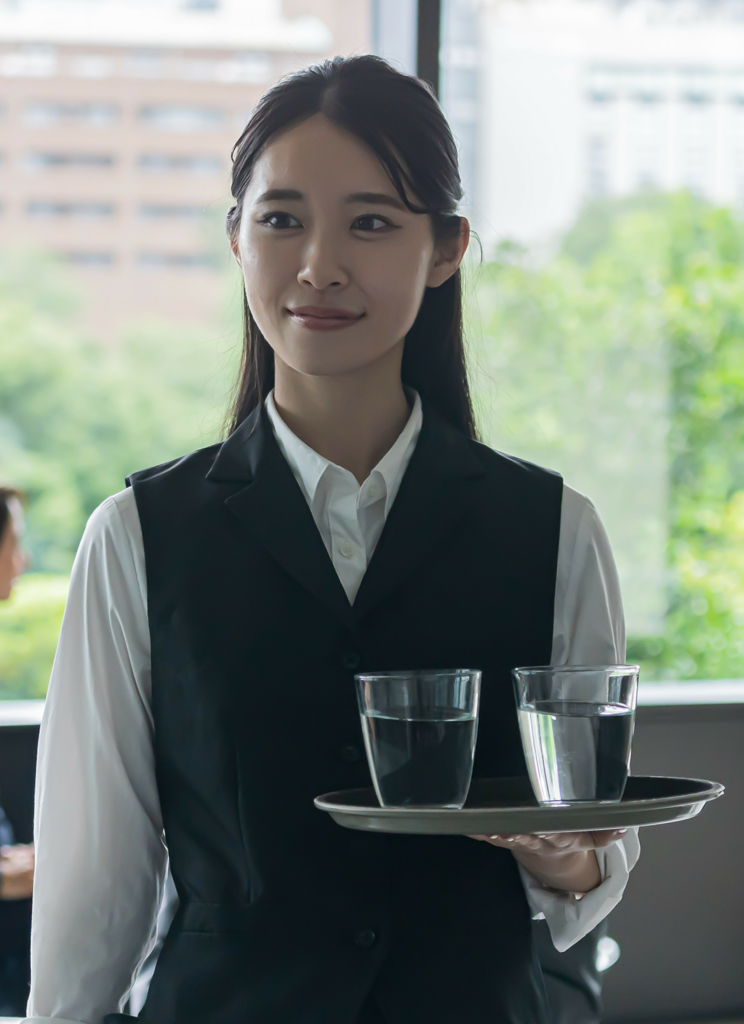 Women serving a glass of water